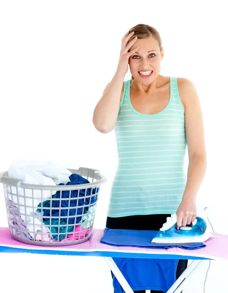 Angry woman ironing — Stock Photo, Image