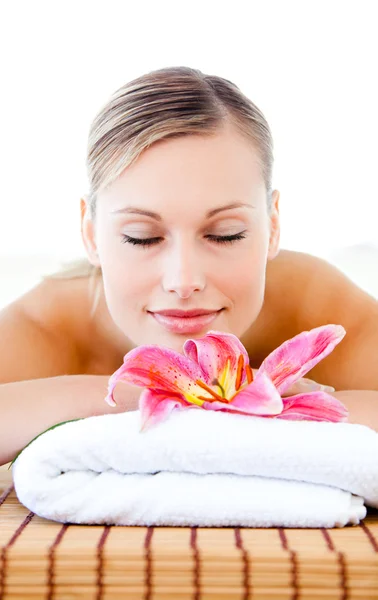Portrait of a relaxed young woman lying on a massage table — Stock Photo, Image
