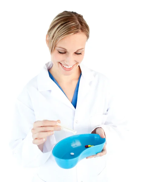 Charismatic female doctor holding capsule — Stock Photo, Image