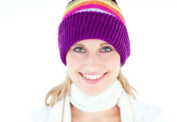 Glowing young woman wearing white pullover and colorful hat — Stock Photo, Image