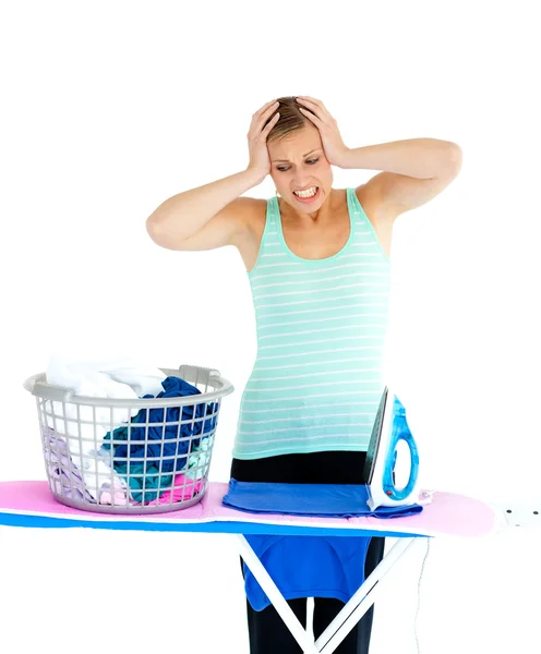 Unhappy woman ironing her clothes — Stock Photo, Image