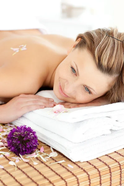 Portrait of a charming woman lying on a massage table — Stock Photo, Image