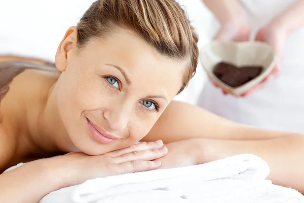 Smiling woman lying on a massage table — Stockfoto