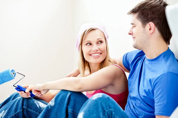 Loving couple painting a room — Stock Photo, Image