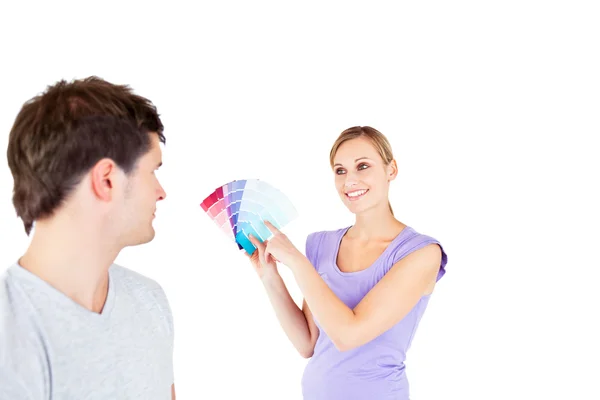 Concentrated young couple choosing color for a room — Stock Photo, Image