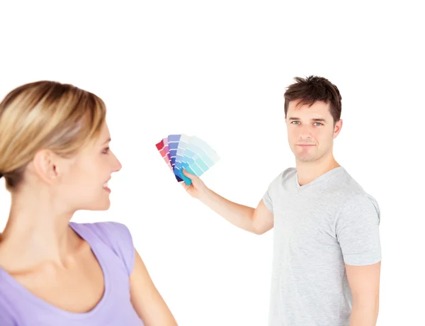 Bright couple choosing color for a room — Stock Photo, Image
