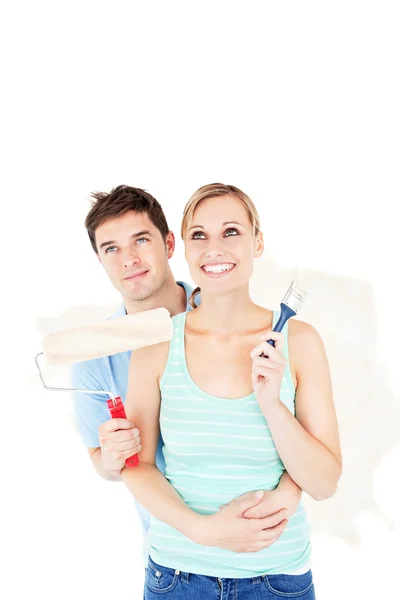 Affectionate caucasian couple painting a room — Stock Photo, Image