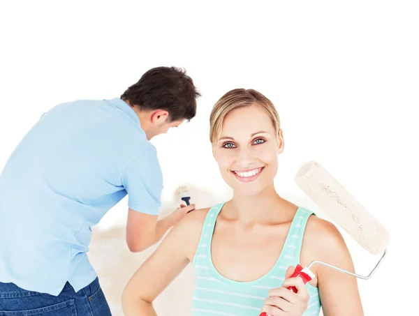 Bright caucasian couple painting a room — Stock Photo, Image