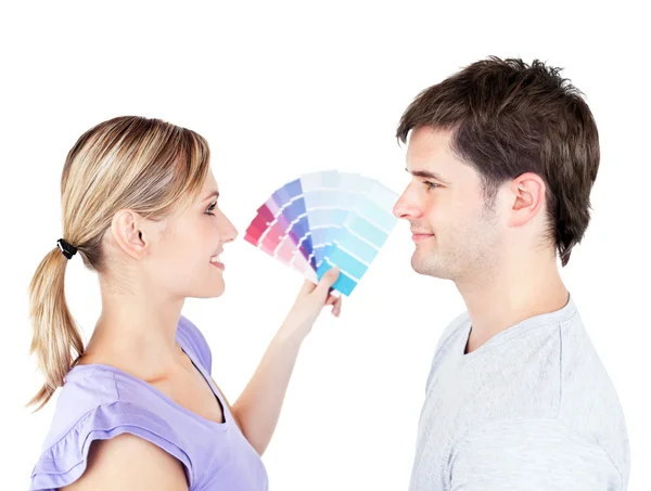 Bright couple choosing color for a room — Stock Photo, Image