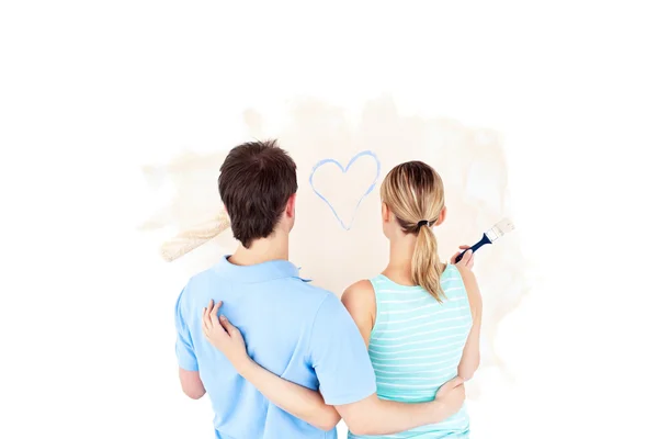 Kind young couple painting a room — Stock Photo, Image