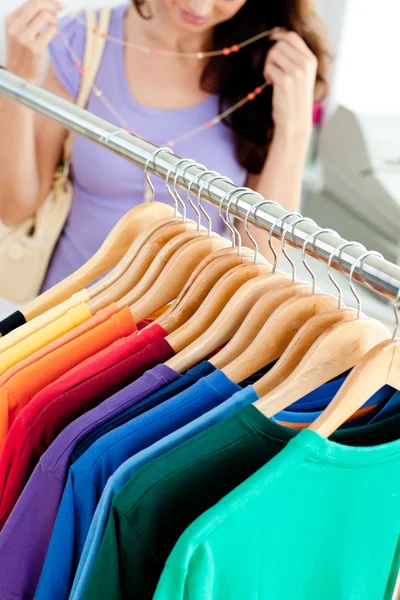 Close-up of clothes with a female customer — Stock Photo, Image