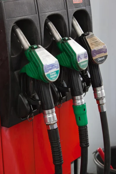 stock image Gasoline pumps nozzles at petrol station