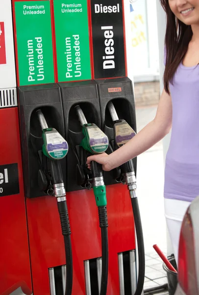 Young woman at the pump — Stock Photo, Image