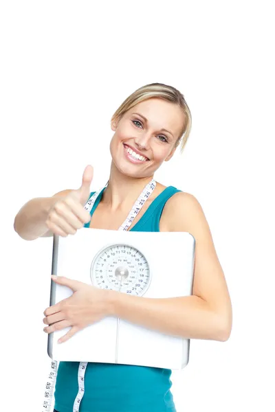 Attractive young woman holding a weight scale — Stock Photo, Image