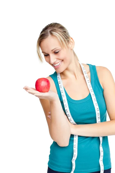 Woman with red apple and measure tape — Stock Photo, Image