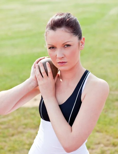Determined female athlete ready to throw weight — Stock Photo, Image