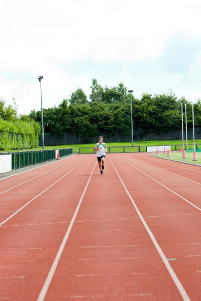 Athletic male sprinter training — Stock Photo, Image