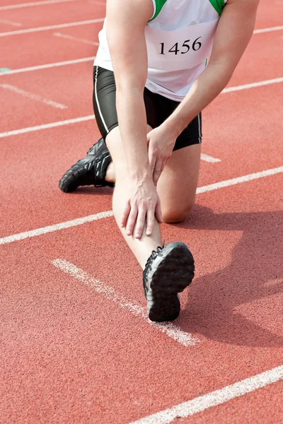 Male sprinter warming up — Stock Photo, Image