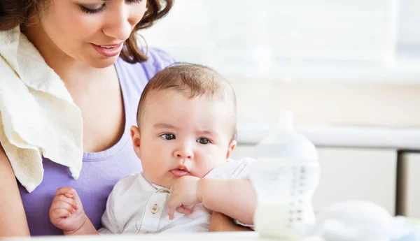 Portrait of a charming mother taking care of her adorable baby i — Stock Photo, Image