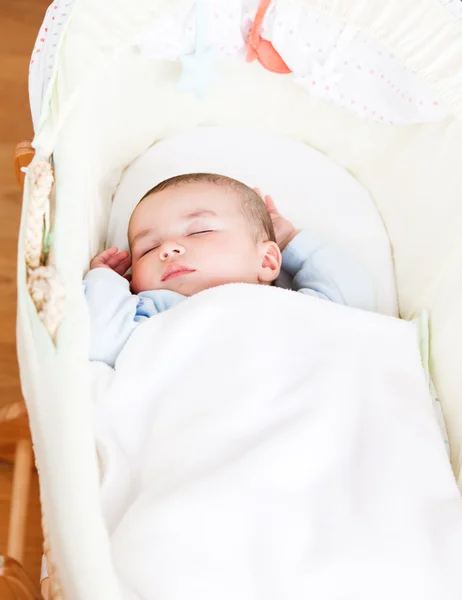 Close-up of an adorable baby sleeping in his cradle — Stock Photo, Image