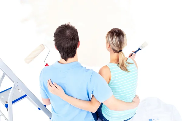 Affectionate couple painting a room — Stock Photo, Image