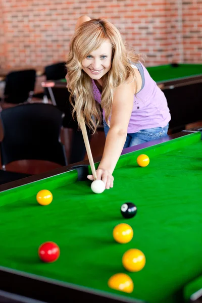 Bright woman playing pool — Zdjęcie stockowe