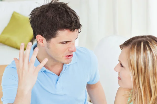 Furious young man working up against his girlfriend — Stock Photo, Image