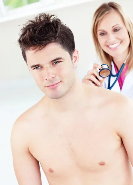 Cute female doctor feeling the breathing of a patient using her — Stock Photo, Image