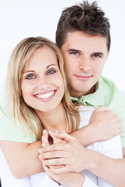Portrait of a lovely couple smiling at the camera standing again — Stock Photo, Image