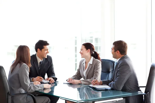 Happy businessteam talking together during a meeting — Stock Photo, Image