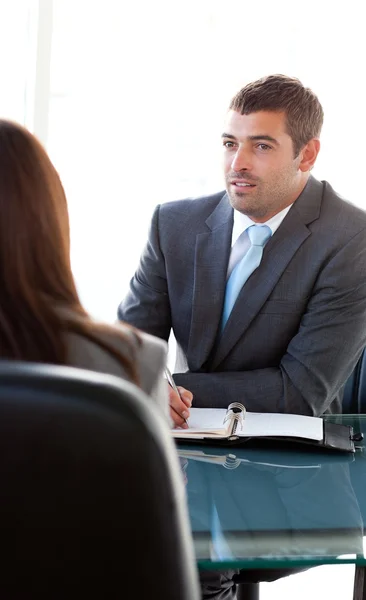 Rear view of a businesswoman talking with a charismatic business — Stock Photo, Image