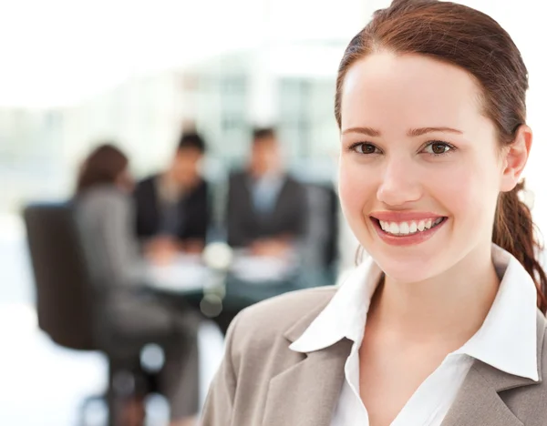 Cheerful businesswoman during a meeting with her team — Stock Photo, Image
