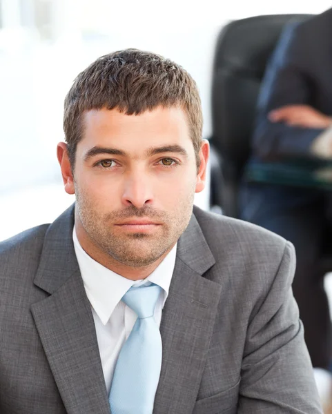 Serious businessman during a meeting with a colleague — Stock Photo, Image