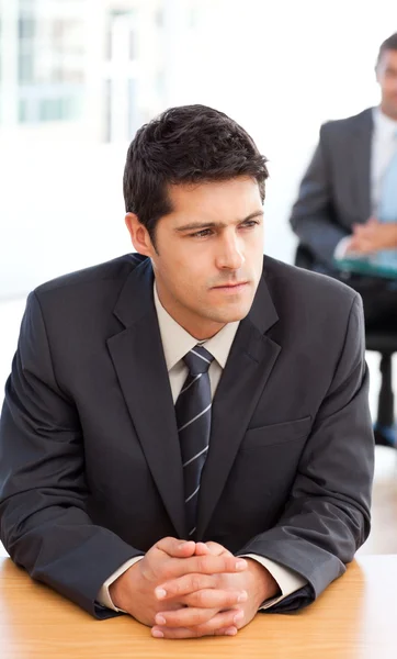Thoughtful businessman during a meeting with a colleague — Stock Photo, Image