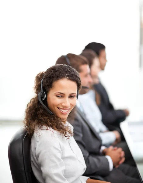 Happy representative with her colleagues working in a call cente — Stock Photo, Image