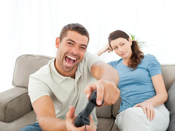 Pretty woman waiting for her boyfrind playing video games on the — Stock Photo, Image