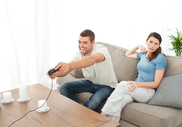 Desperate woman being bored while her boyfriend playing video ga — Stock Photo, Image