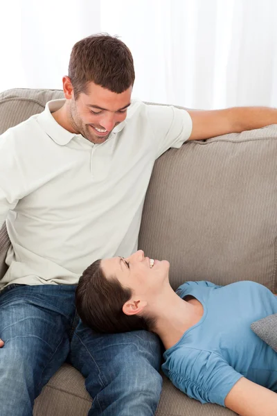 Lovely woman lying on the sofa with her boyfriend — Stock Photo, Image