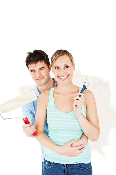 Cheerful couple painting a room Stock Picture