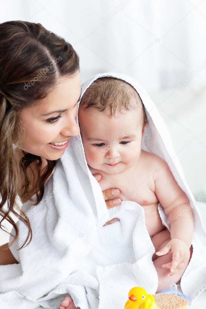 Delighted Mother Drying Her Baby After His Bath Stock Photo