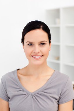 Portrait of an european woman in the kitchen clipart