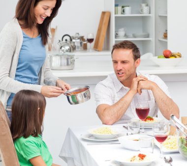 Proud dad talking to his daughter while her mother giving her pa clipart