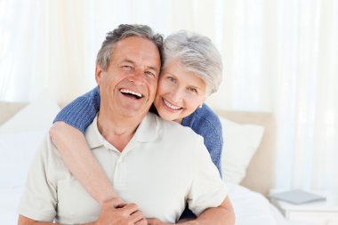 Senior couple looking at the camera clipart