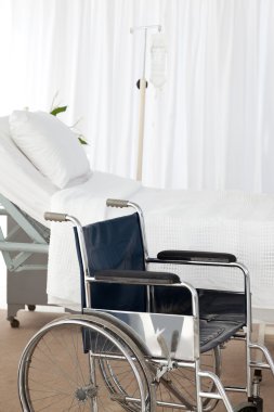 A wheelchair in a room clipart