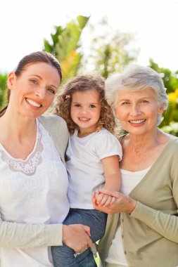 Portrait of a family looking at the camera clipart