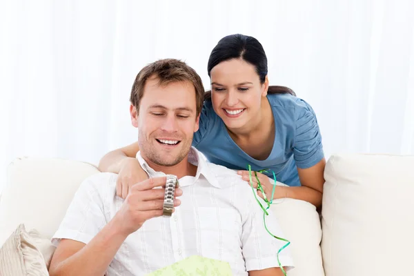 Happy man looking at a watch given by his girlfriend — Stock Photo, Image