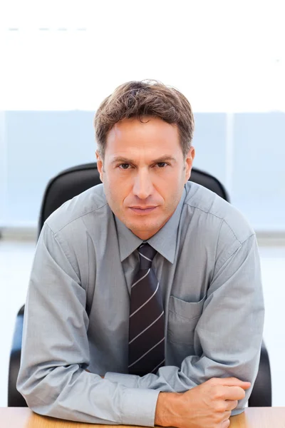 Serious manager sitting at a table — Stock Photo, Image