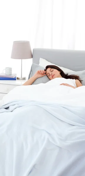 Serene mother sleeping peacfully on the bed — Stock Photo, Image
