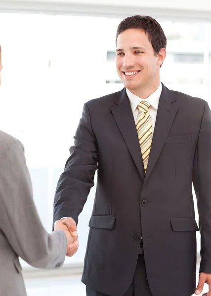 Successful businessman shaking hands with a young businesswoman — Stock Photo, Image