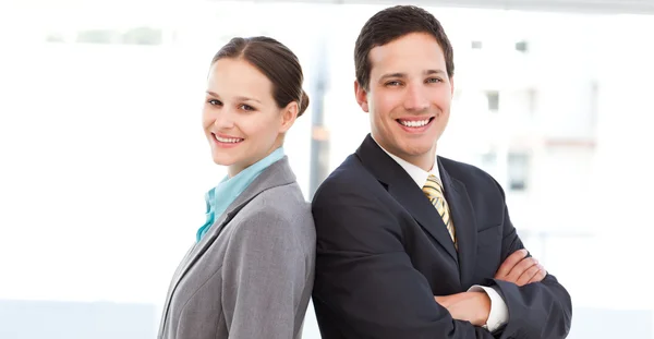 Happy partners posing togetherback to back — Stock Photo, Image